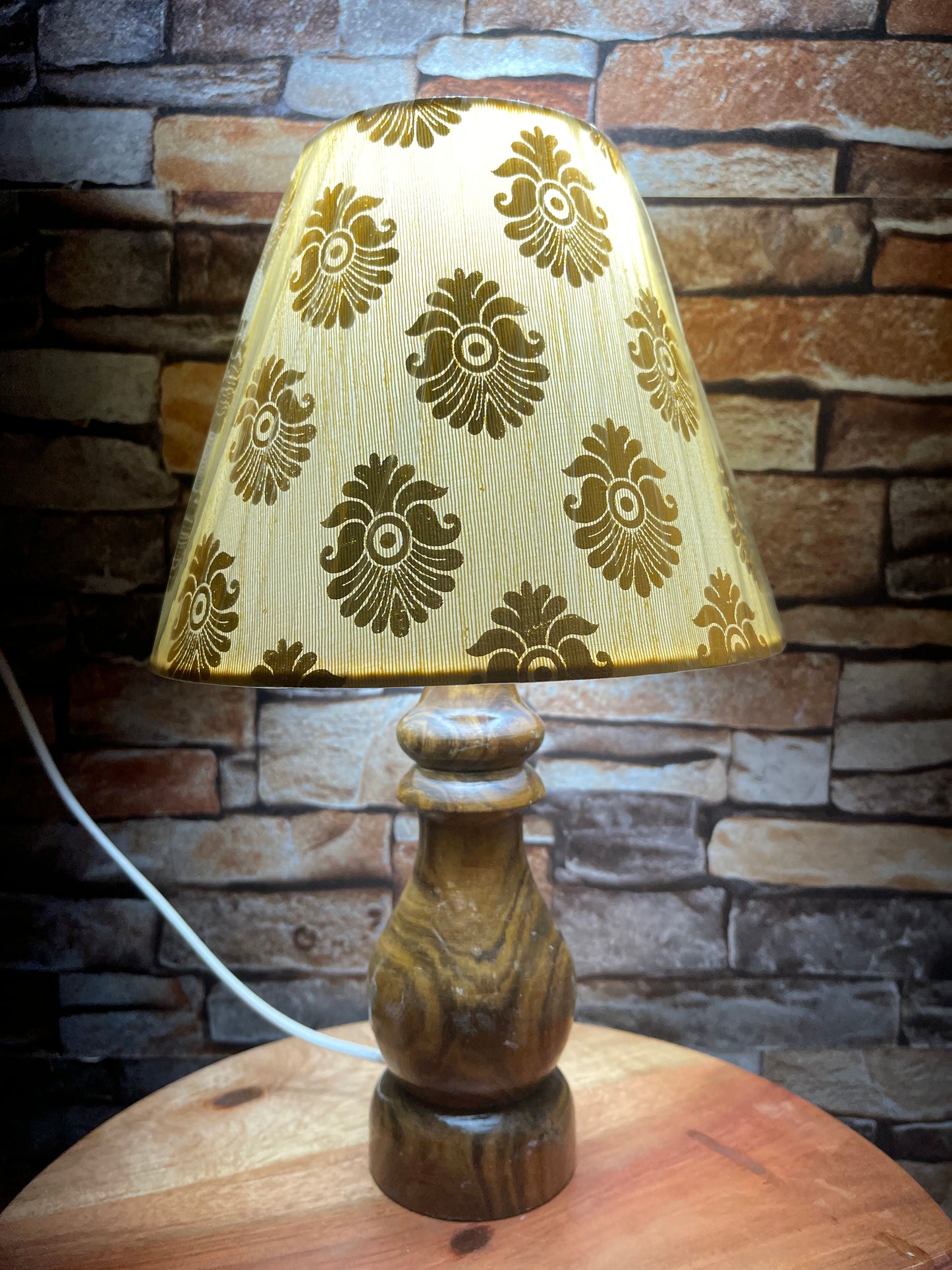 Gold print on cream base lamp shade with wooden base