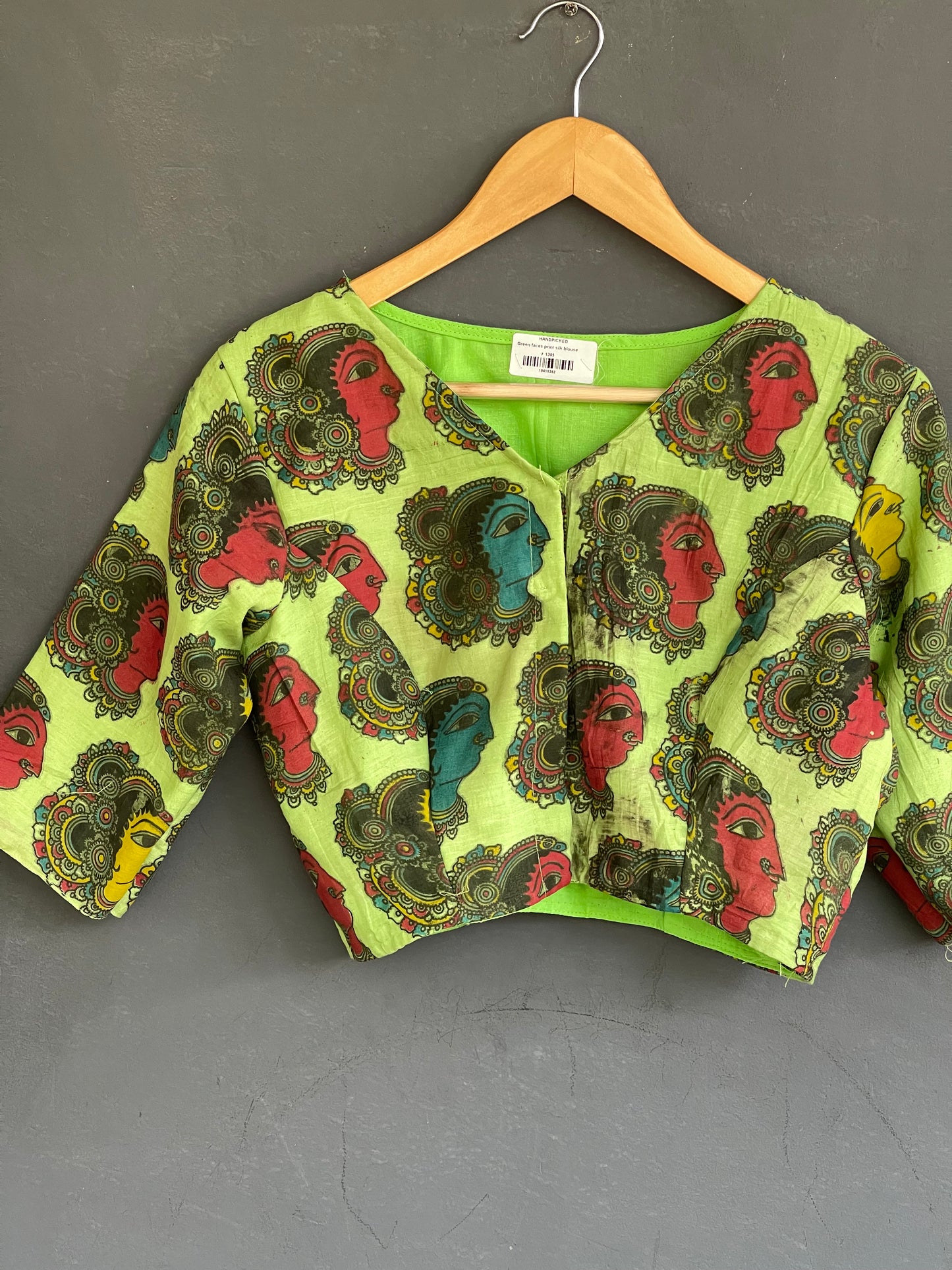 Green faces print kalamkari blouse with lining