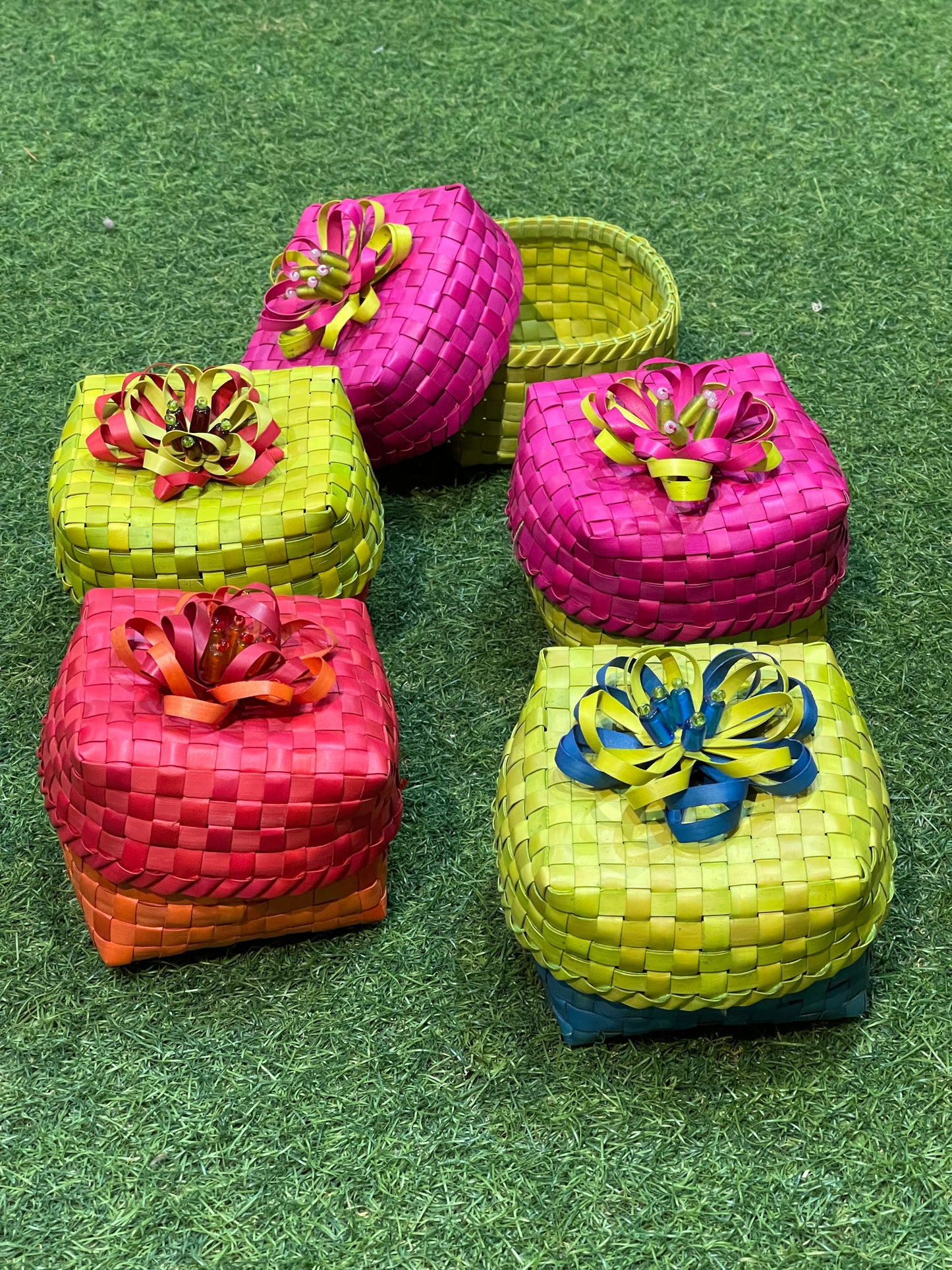 Palm leaf colourful handmade boxes with flower on top