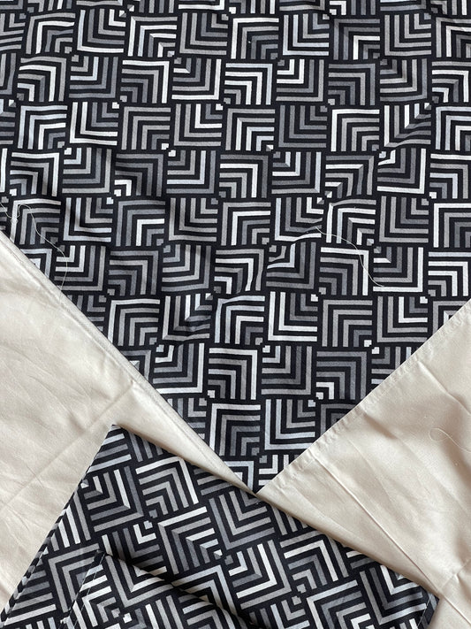 Black geometric print on white base cotton bedsheet with border - 96 x 110 inches