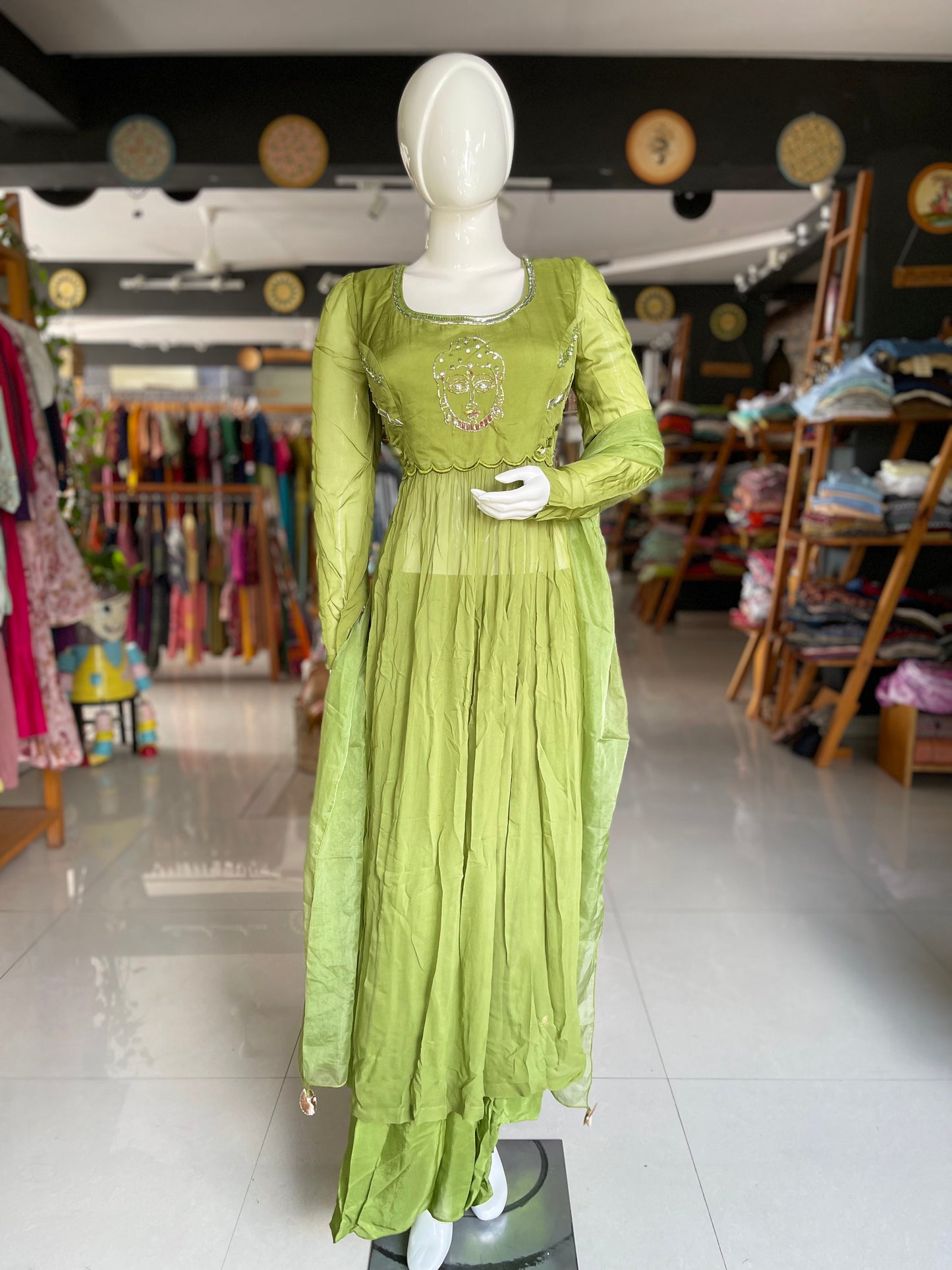 Green embroidered long top with matching pants and dupatta