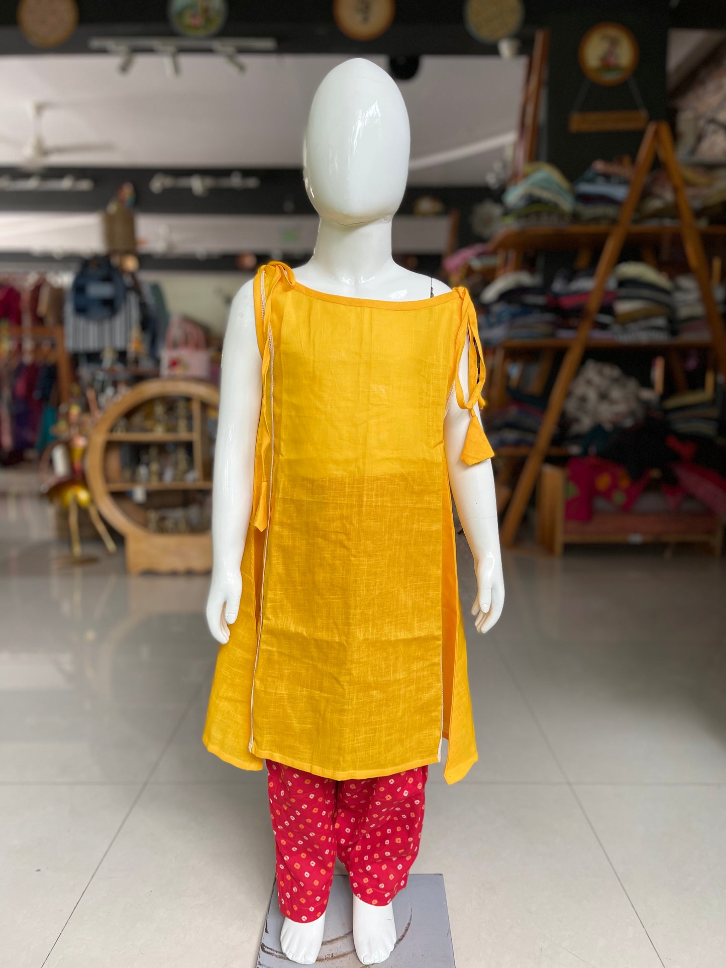 Yellow cotton kurta with red bandini salwar for little girls