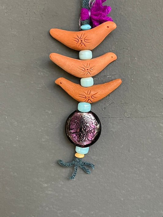 Terracotta bird car hanging blue beads