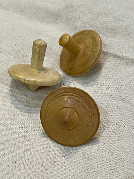 Wooden handmade spin top