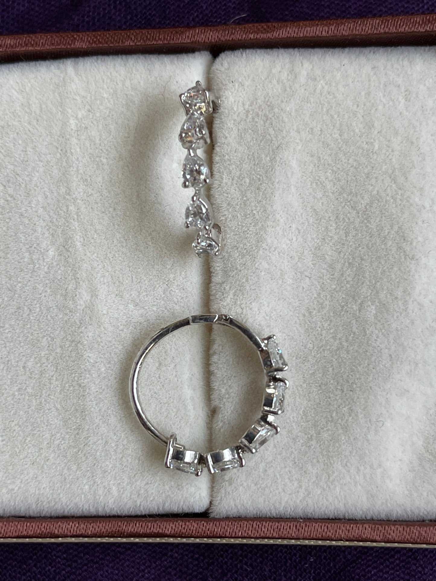 Silver hoops with sparkles stones in beautiful in bud shape