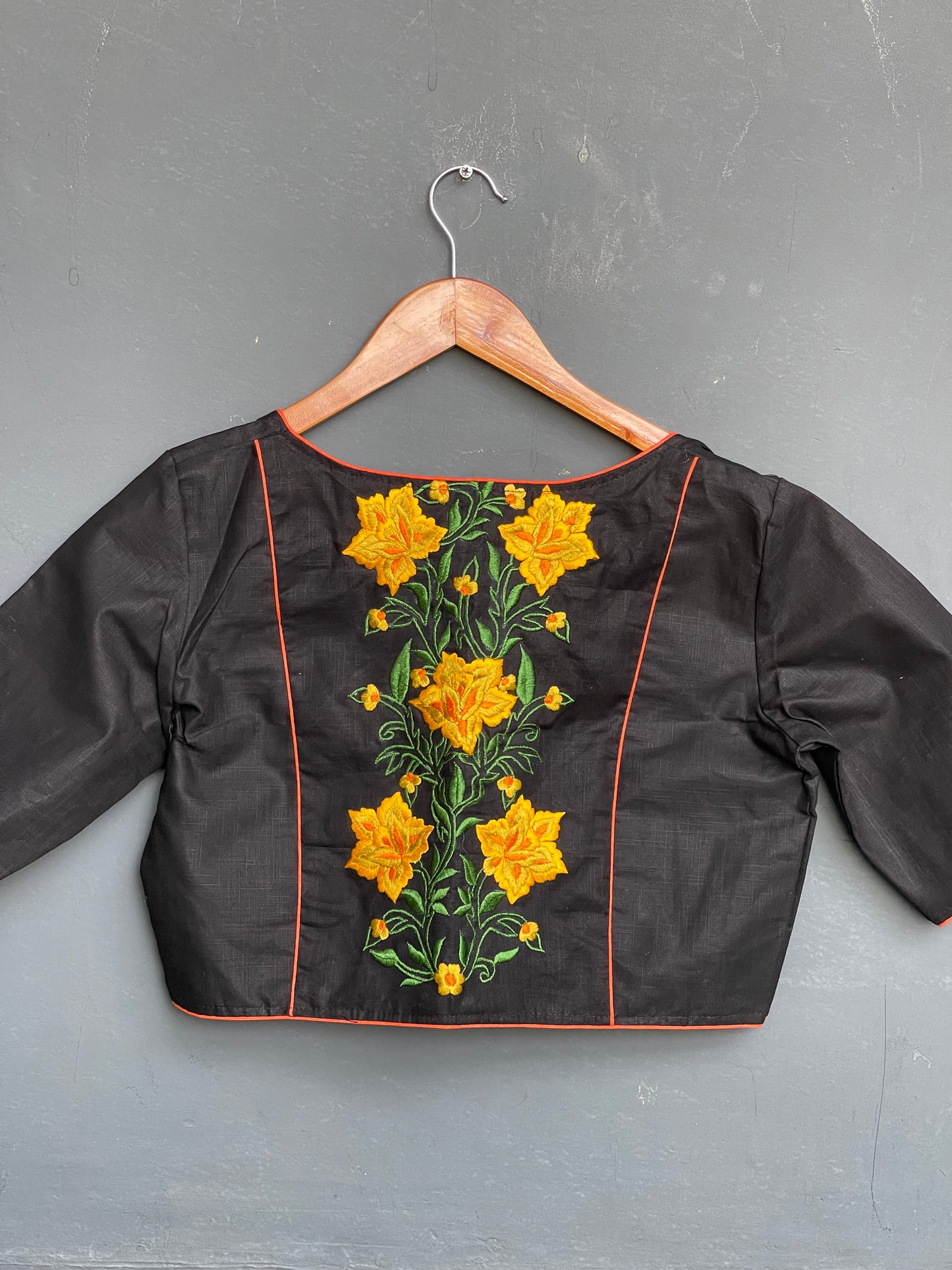 Black cotton blouse with yellow flowers at the back