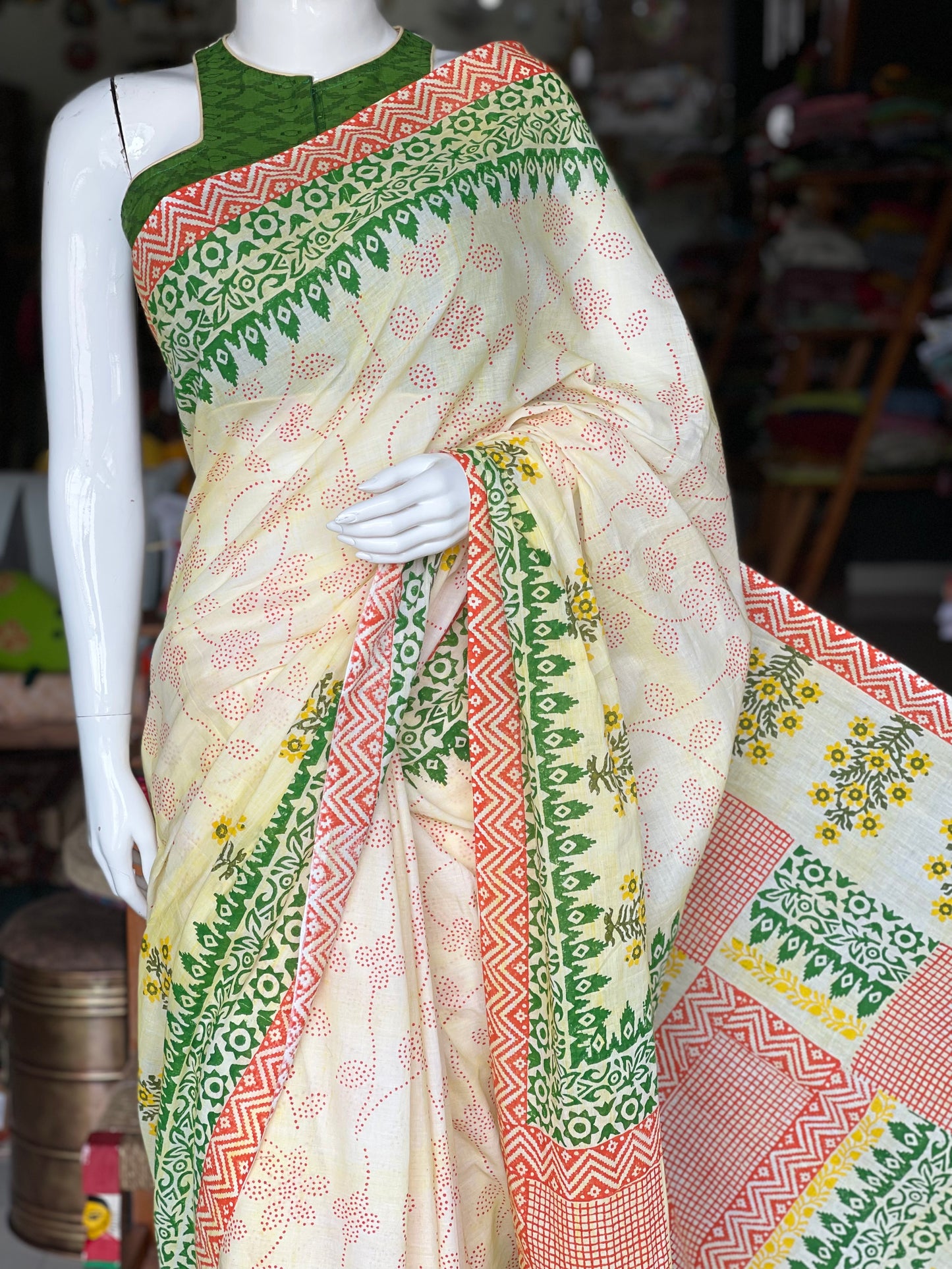 Orange and green block printed cream color soft cotton saree