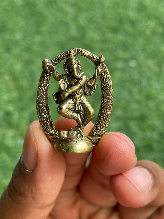 Brass miniature dancing Ganesha with arch / prabhavali