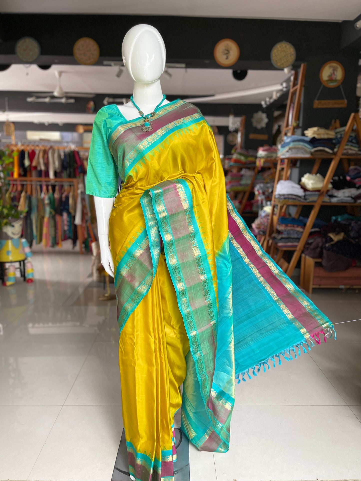 Beautiful mustard and green combination pure silk handwoven Gadwal saree with temple borders