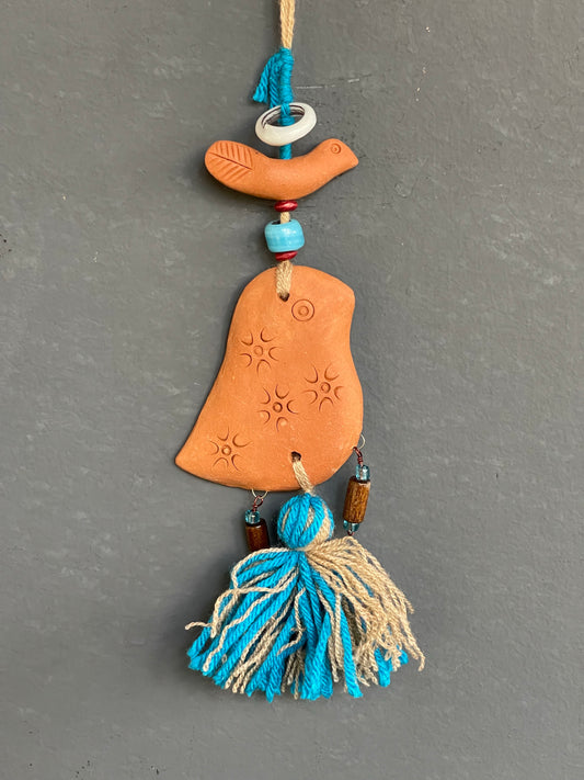 Terracotta bird car hanging blue tassle