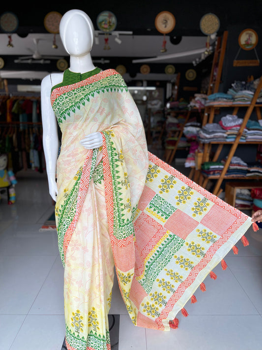 Orange and green block printed cream color soft cotton saree